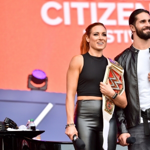 Becky Lynch and Seth Rollins speak onstage