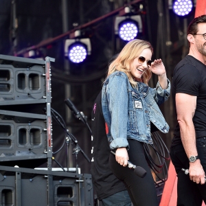 Rachel Brosnahan and Hugh Jackman speak onstage